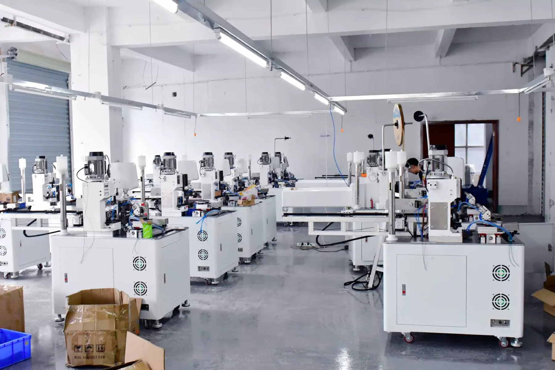 Rows of compact wire-processing machines inside the Wiromac Dongguan workshop