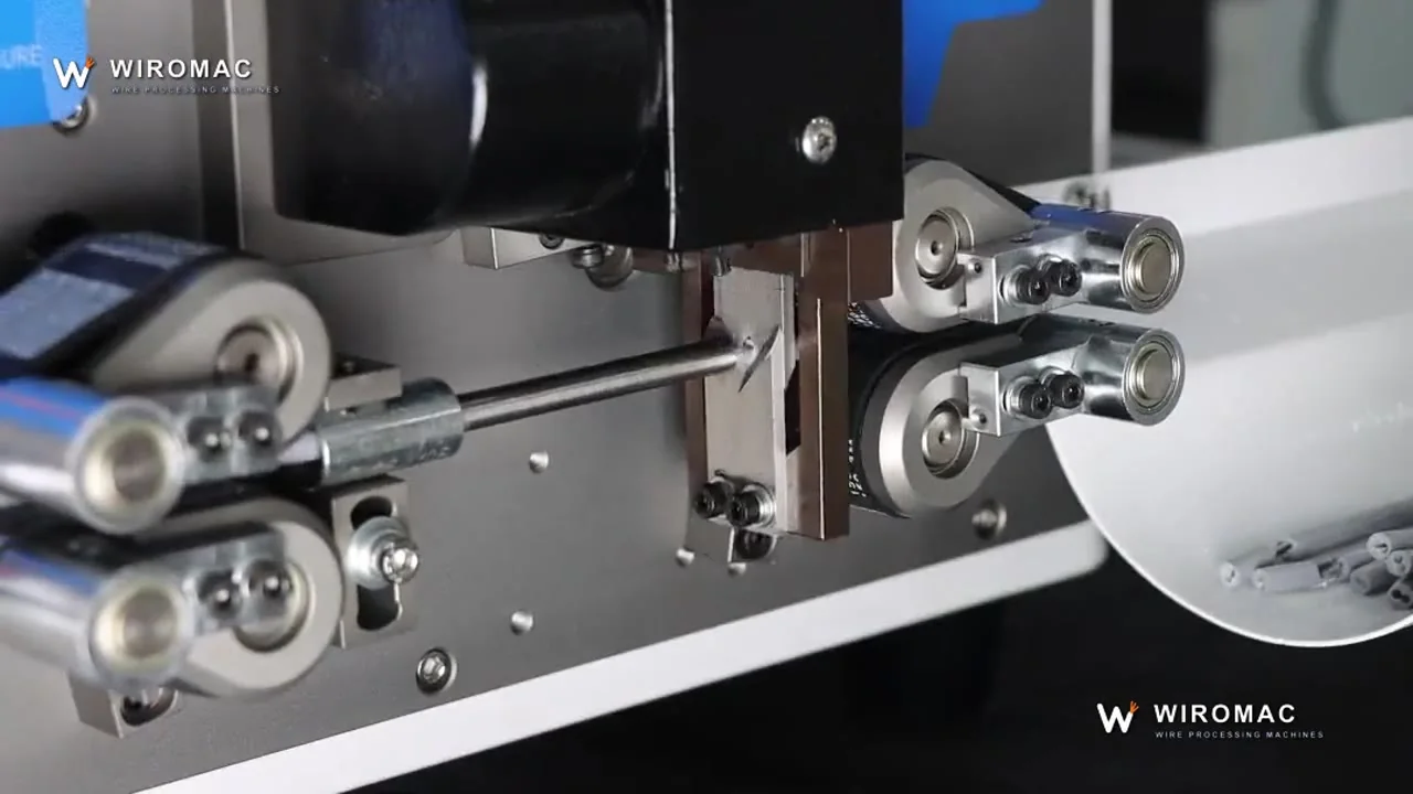 Round sheathed cable up to 10 mm² on a belt-fed bench cutter — blue lead through the guide.