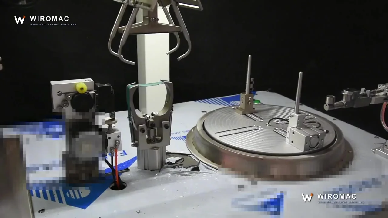 Turntable coil winding with automatic tie — the coil lifted off finished.