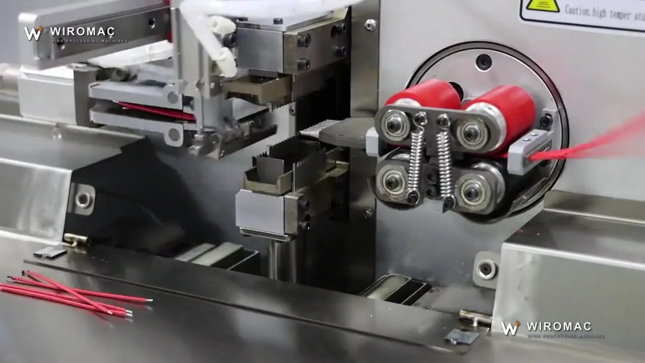 Double-end tinning on sheathed cable — red leads into the pot and out.