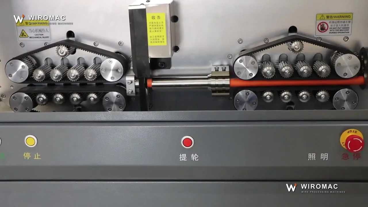 Large orange power cable on a wide belt drive — cut to length, jacket off.