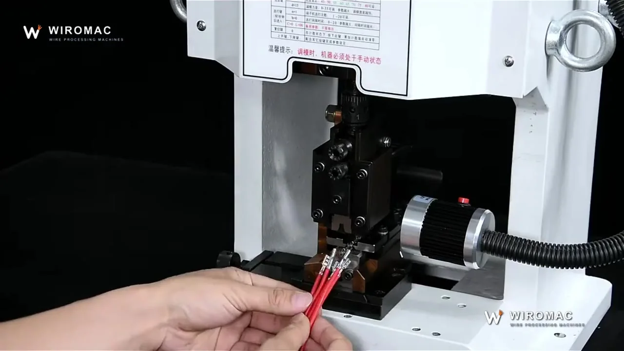 Bench crimper with interchangeable dies — orange and green leads crimped hand-fed.