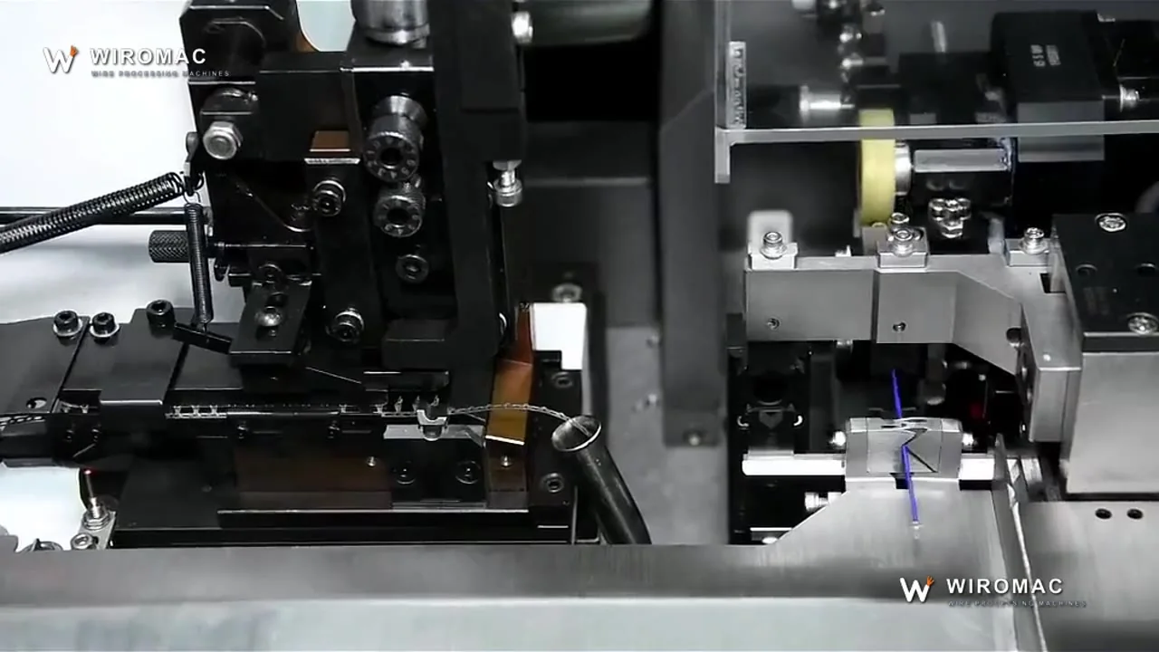 Strip-and-crimp on fine electronic wire — the applicator indexes one terminal per stroke.