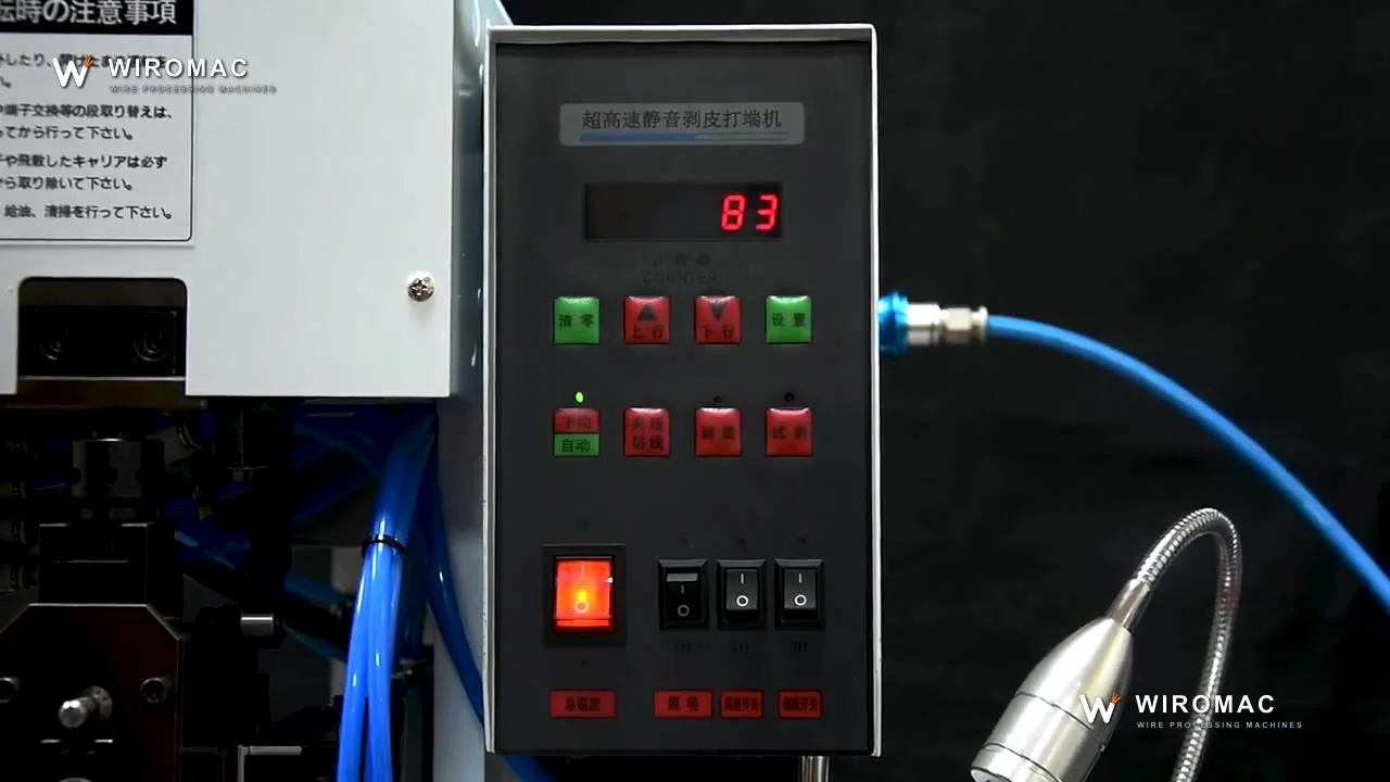 Ring terminals crimped on yellow and green leads, strip and crimp in one station.