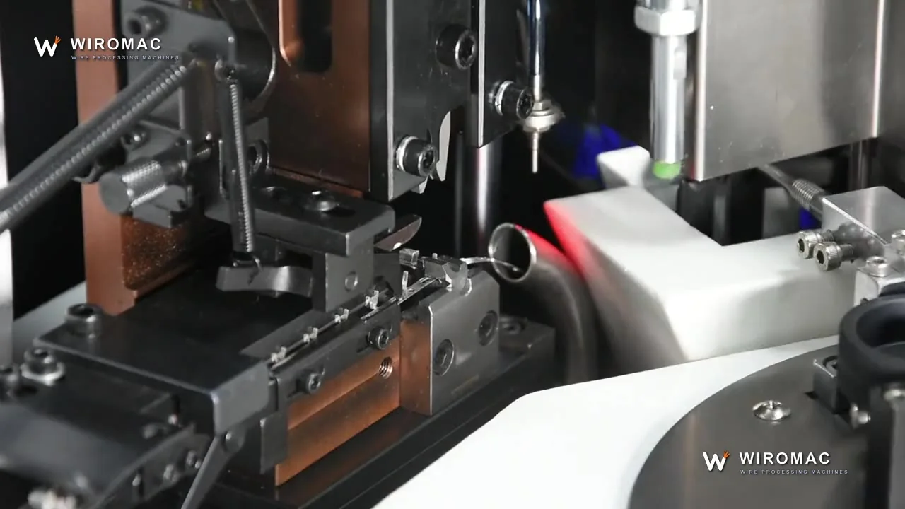 Automatic single-end crimp — yellow leads fall terminated into the tray.
